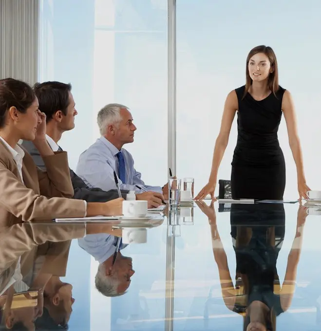 A group of people sitting around a table.